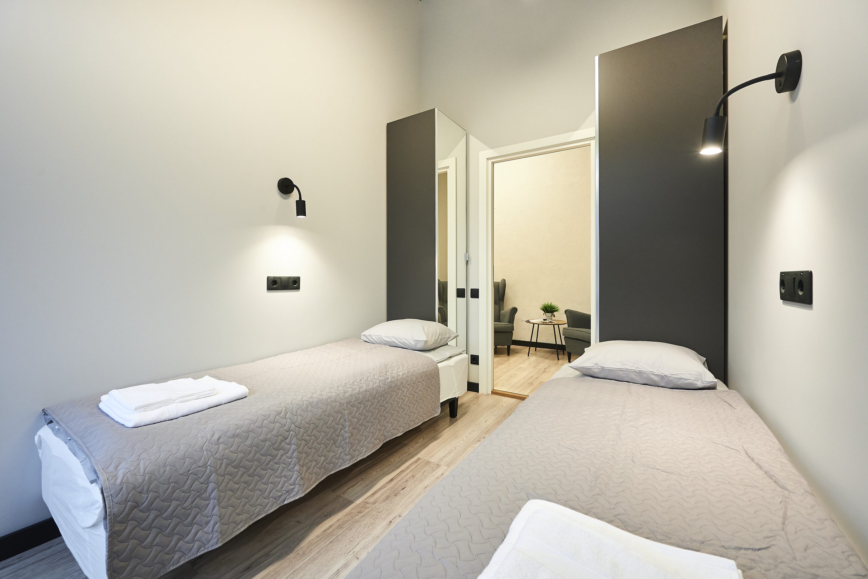 Private twin room with a large window onto the street
